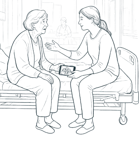 A relative sits beside an older woman on a hospital bed and shows her a family photo on a phone.